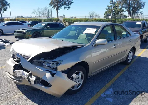 2002 Toyota Camry Le from USA, damaged, VIN JTDBE32K720052674